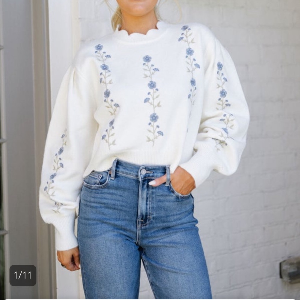 Elegant White Sweater with Blue Floral Design